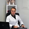 Dr. Gkomouzas